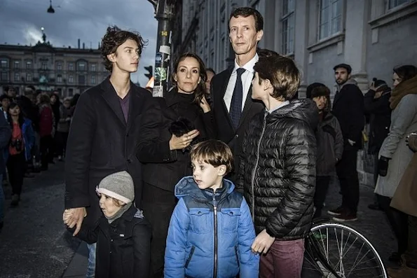 Prince Joachim of Denmark, Princess Marie of Denmark and their children prays tribute to victims in front of the French embassy in Copenhagen