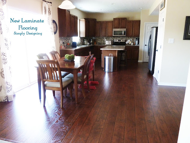 laying and installing laminate floors tutorial photo of finished kitchen with laminate wood floors