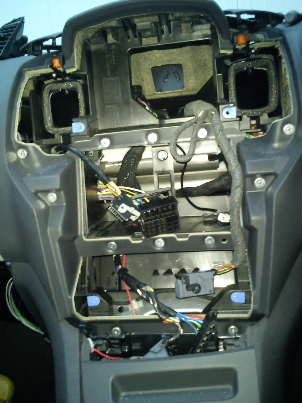 4) The red 12v Ignition cable should be thread through the bottom of the gearbox, ash-tray and ending up next to the base of the cigarette lighter socket.