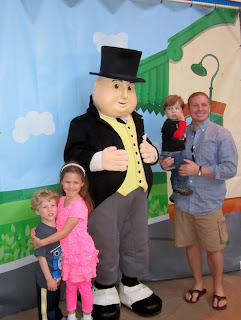 Alex was a little freaked out by the costumed man, so Dan had to step in for the picture :)