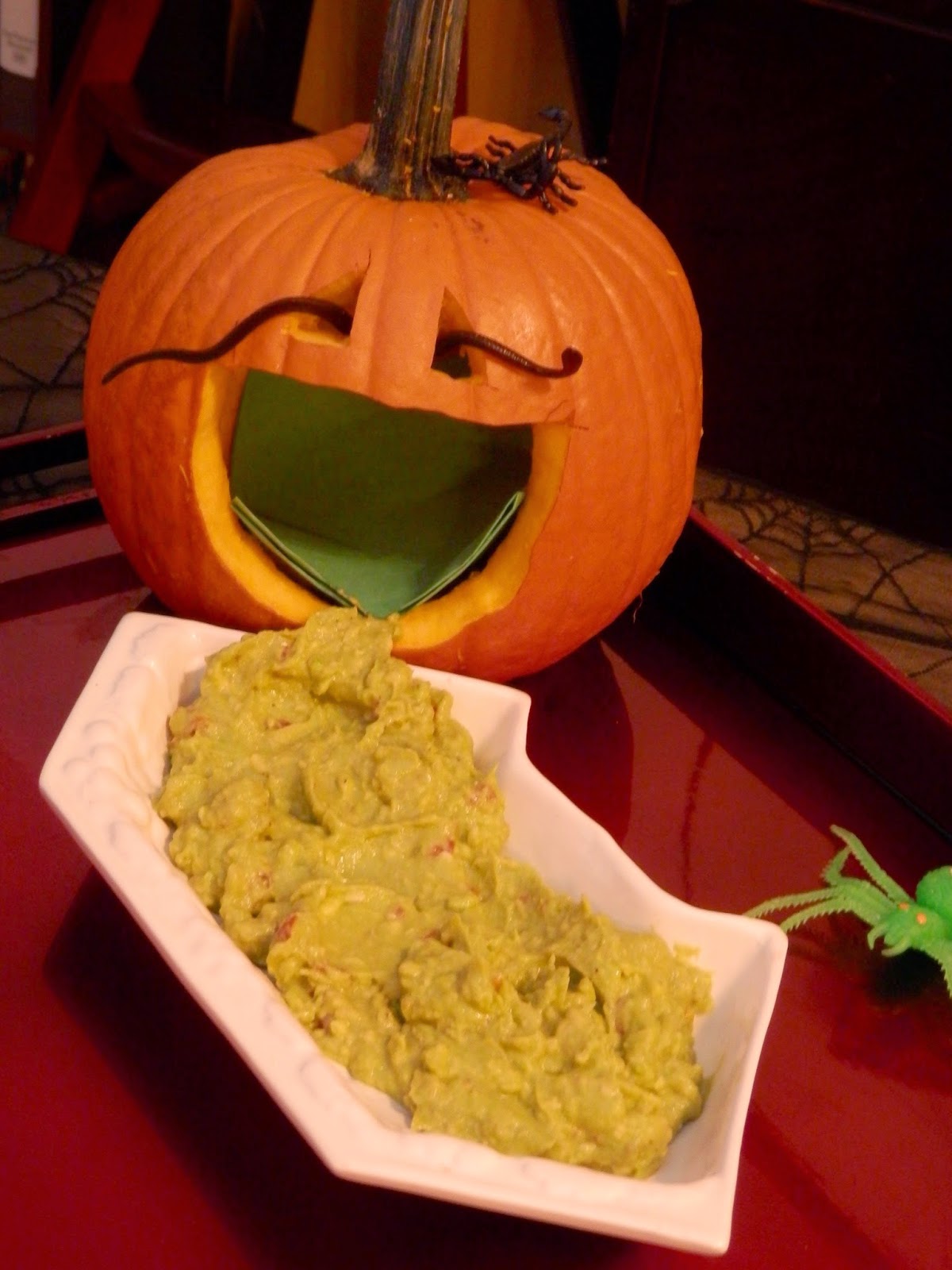 Halloween pumpkin throwing up guacamole