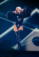 Jennifer Lopez strikes a pose in a tiny black leodard on stage