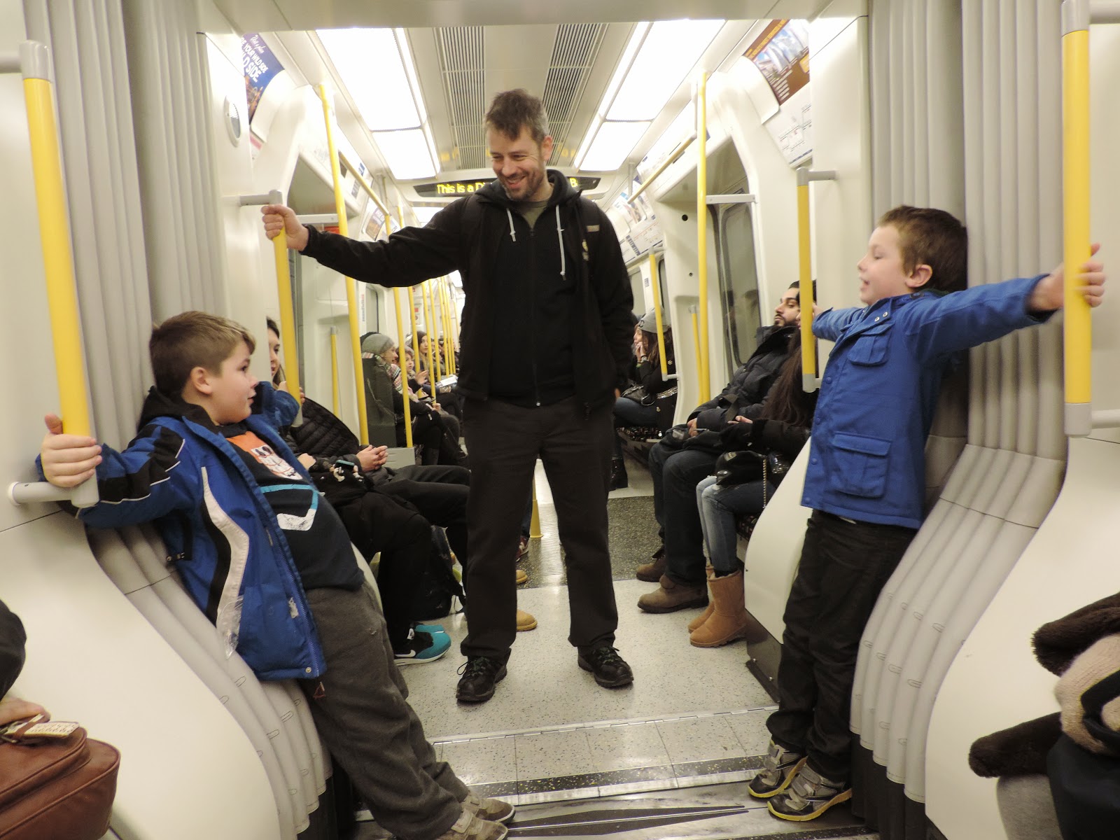 boys having fun on london transit system