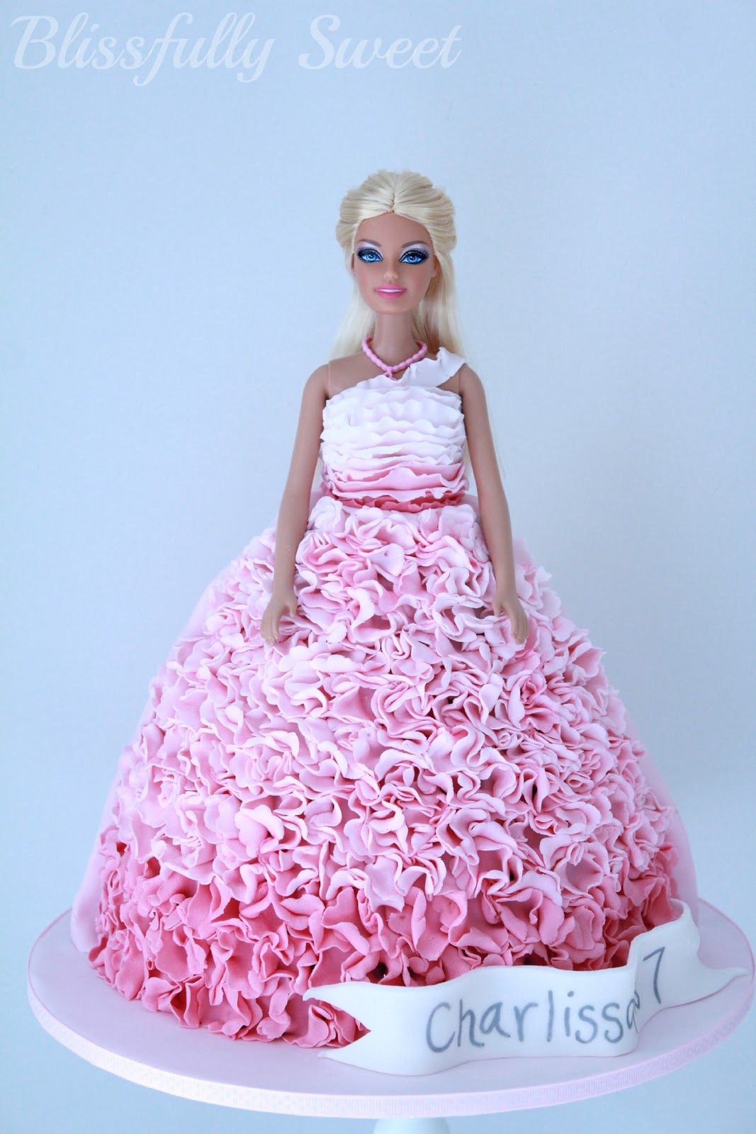 Blissfully Sweet: An Ombre Pink Ruffled Barbie Birthday Cake