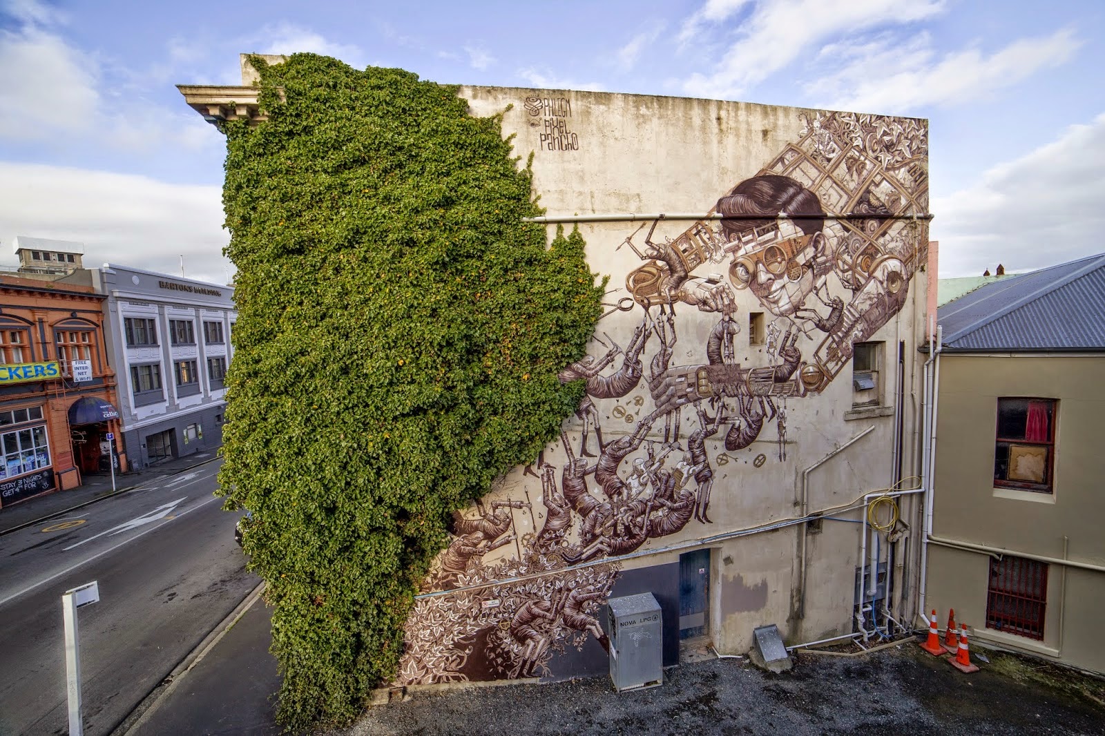 Phlegm and Pixel Pancho team up to paint a new mural in Dunedin, New