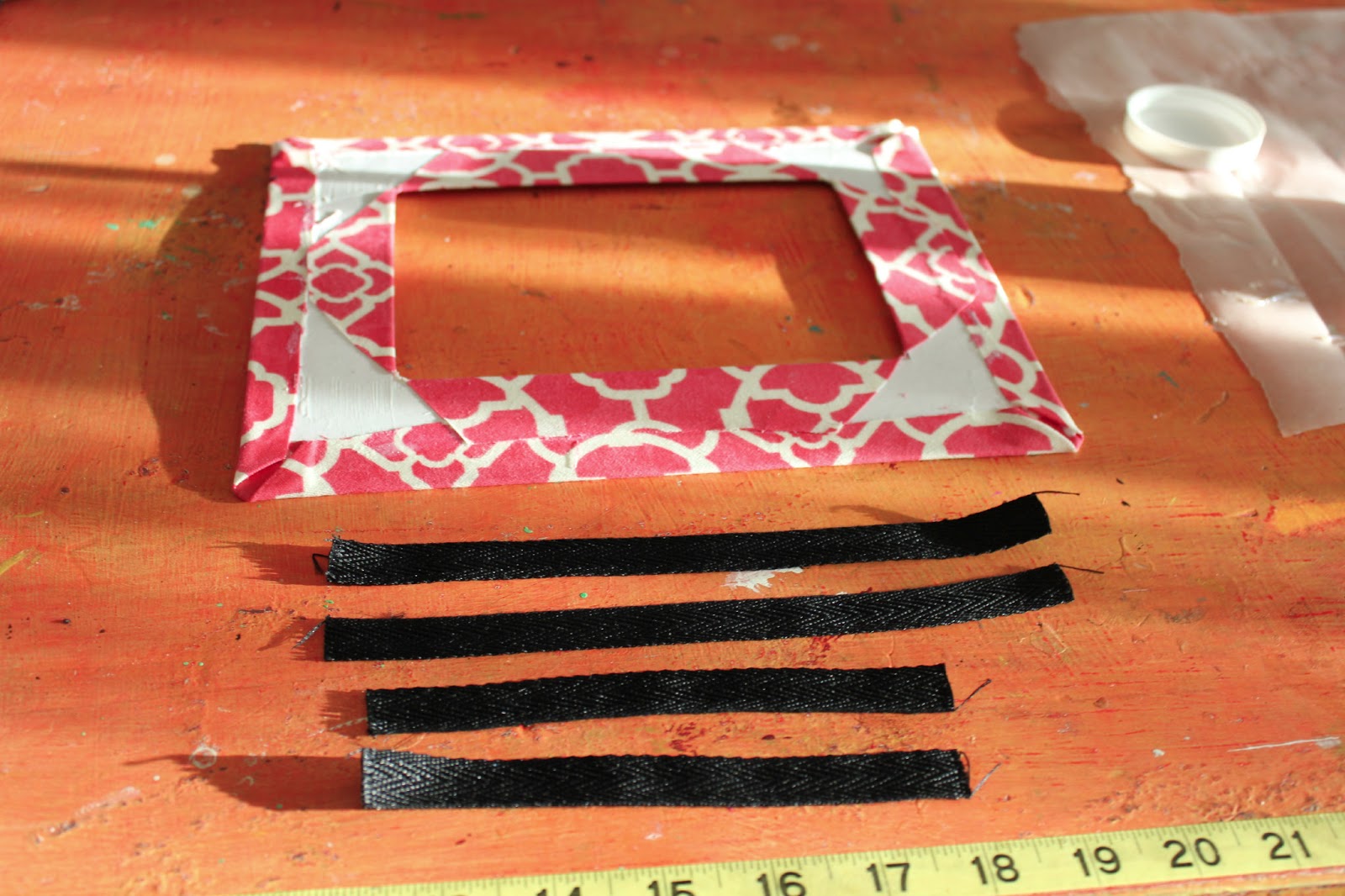 Cathie Filian DIY How to cover a photo mat with fabric and Mod Podge.