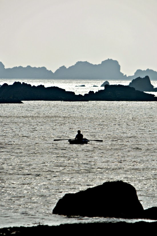 Man in rowing boat Isles of Scilly