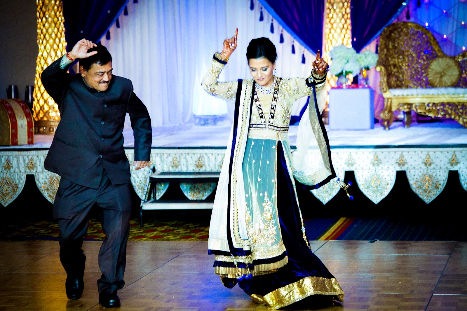 the traditional father daughter dance at the reception indian