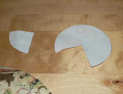 cutting out paper to make curled paper christmas trees