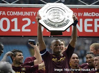 Vincent Kompany of Manchester City with Community Shiled trophy