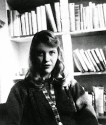 There are lots of Plath photos out there, but I like this one, with all the books, the best.