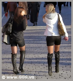 Girls in high heel boots on the street