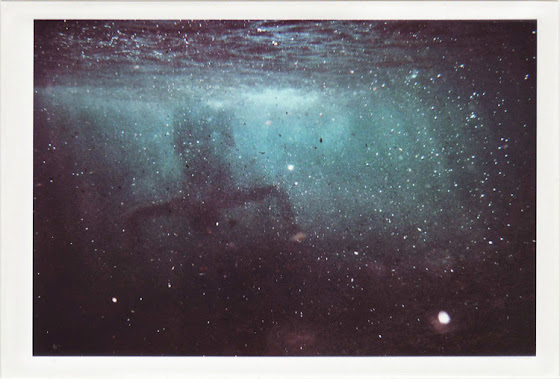 dirty photos - a - dark underwater photo of man upside down