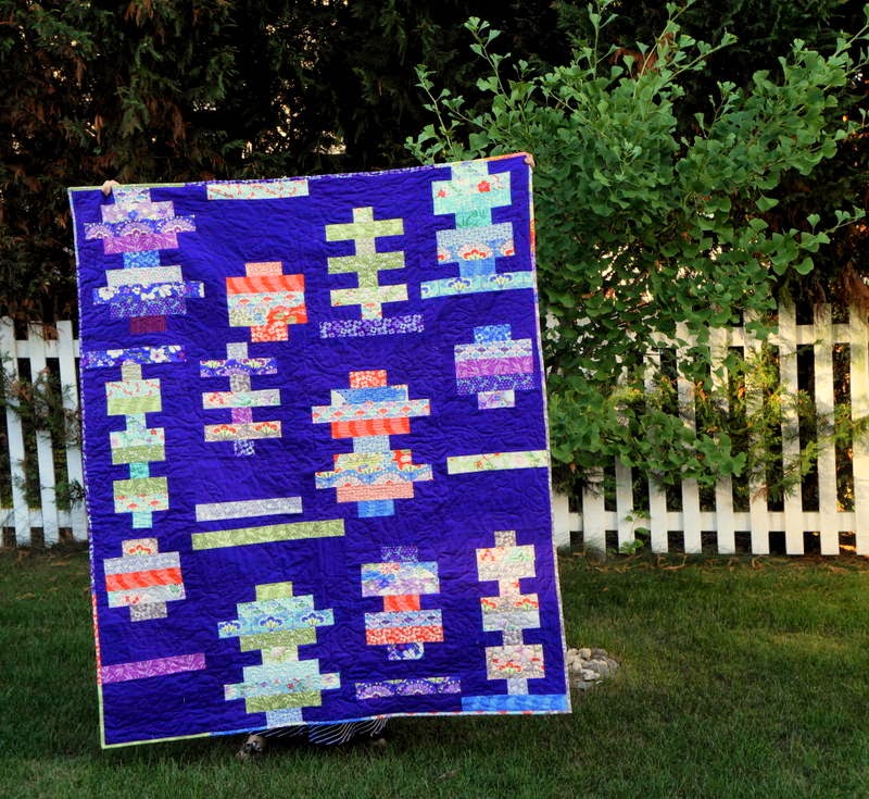http://quiltyhabit.blogspot.com/2014/07/midsummer-finished-quilt.html