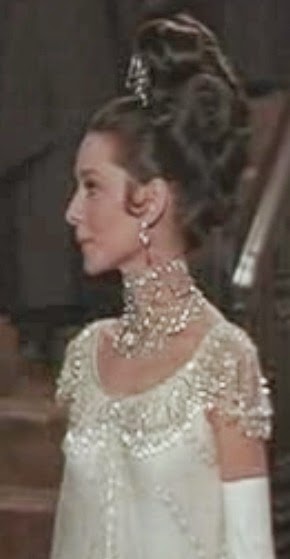 Audrey Hepburn as Eliza Doolittle.