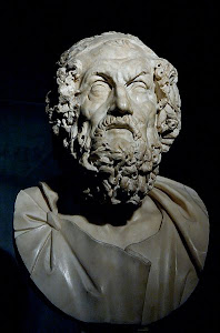 Homer, Omiros in Greek, author of the Iliad and the Odyssey.