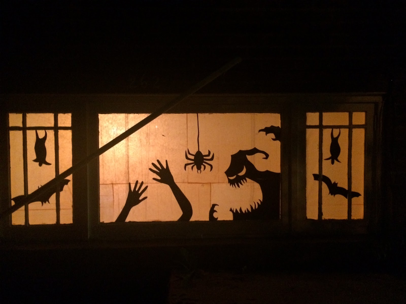 then just tape it on your window then tape up orange tissue paper im sure you could also do green for a more eerie look - Halloween Window then just tape it on your window then tape up orange tissue paper im sure you could also do green for a more eerie look - Halloween Window
