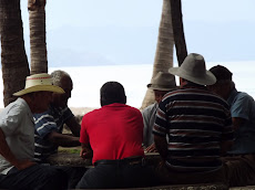 Locals playing dominos on the beach