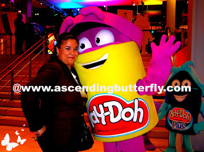 Ascending Butterfly poses with Play-Doh Mascot during Hasbro Toy Fair 2013 Event in New York City