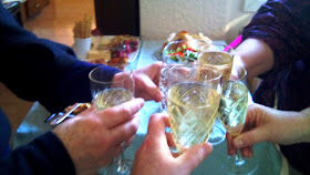 Five glasses of sparking wine toasting.