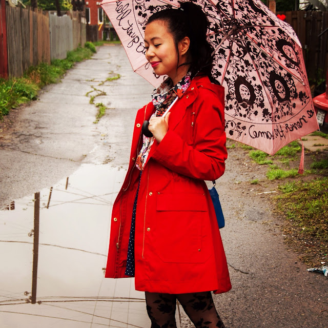 pink umbrella red raincoat floral blouse polka dot skirt
