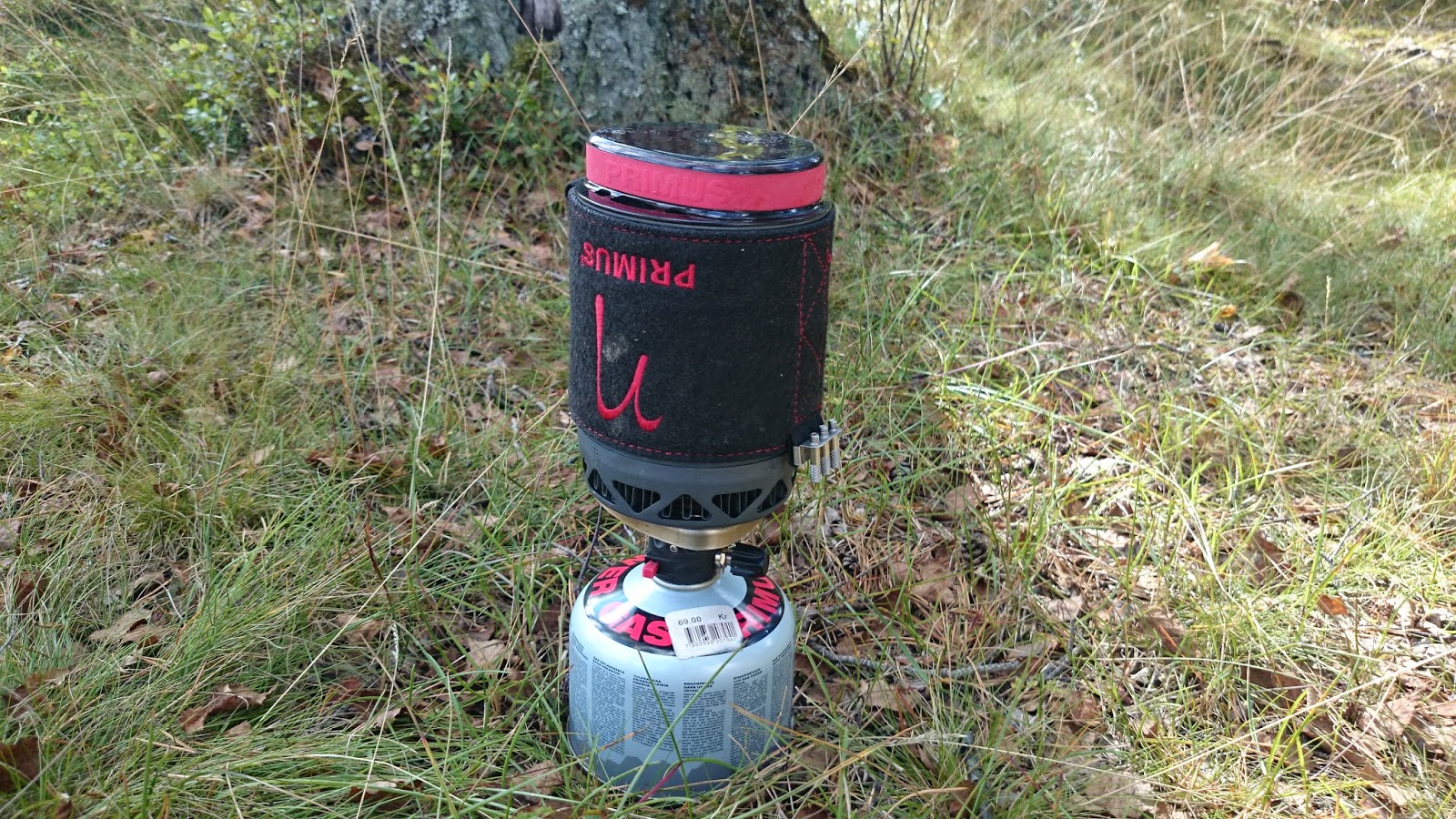 Brooks Range gear reflections on stove and footwear