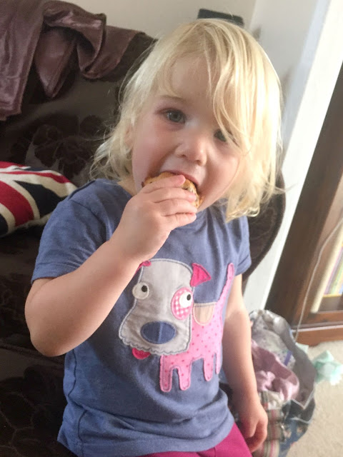 Tin Box Tot eating a muffin