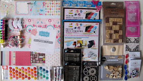 A range of paper craft supplies arranged on a desktop.