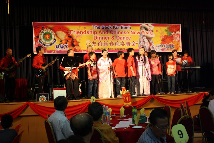 The Evergreen Band accompanying the Mudita Home Children singing some Chinese New Year songs