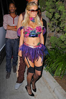 Paris Hilton shows off a lot of skin in a skimpy Halloween costume