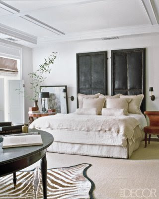  master bedroom floor is draped with a chocolate brown & white zebra rug, 