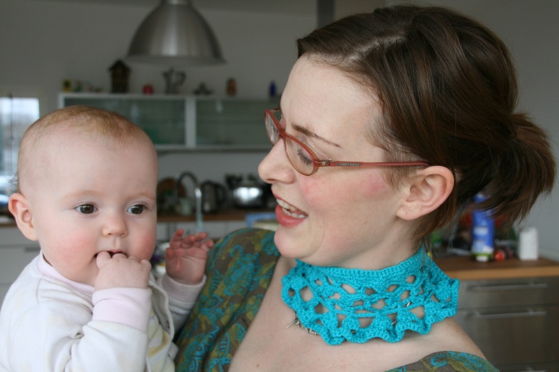 Natalie in crochet collar with little Maia
