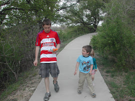 Walking a paved trail at Arbor Hills nature preserve
