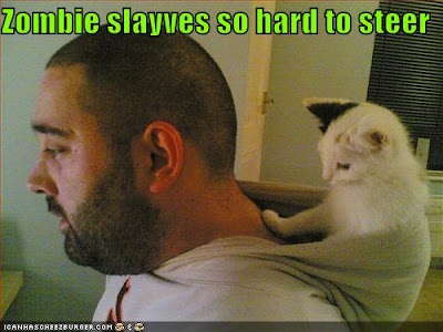 funny-pictures-cat-controls-zombie-human.jpg