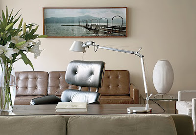 home office combined with the brown couch and the wall of the room light brown