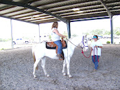 Sondra gives a riding lesson.