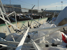 A dumpster full of canopies