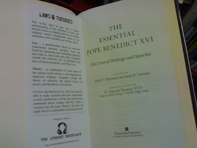 Religious text with extra page insert Religious text with extra page insert