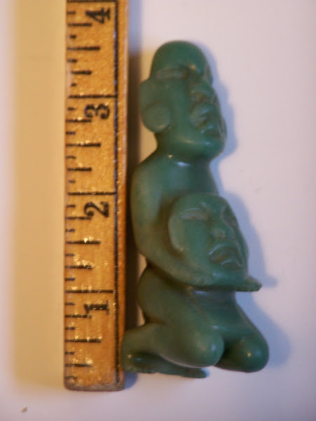 Olmec Jade Idol holding Mask