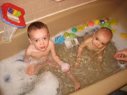 Brother And Sister Playing In Bath Stock Image - Image of 