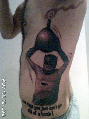 OK this Batman Tattoo has the word WIN written all over it