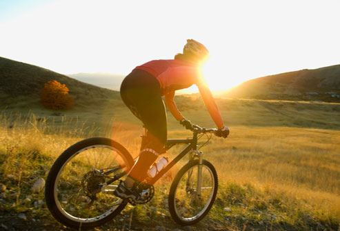 getty_rf_photo_of_woman_biking_downhill.jpg