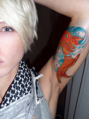 Women tattooed fish species