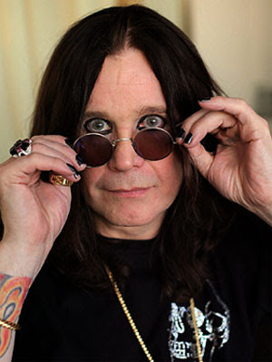 ozzy osbourne puts on sunglasses