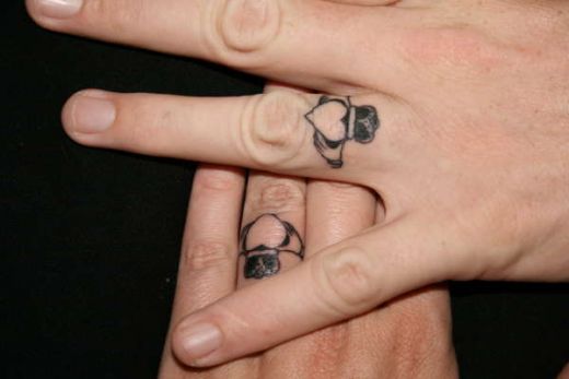 Mark and I are considering getting Best art wedding ring tattoo designs
