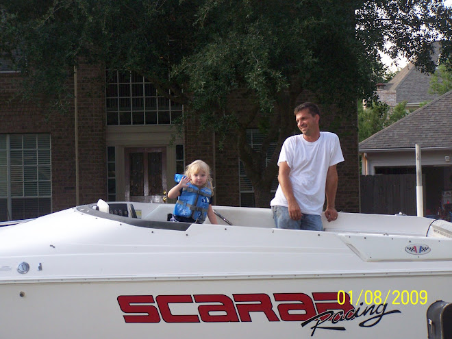 Playing in the boat...parked in front of the house