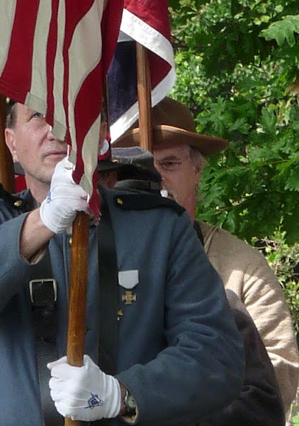 A MASON CARRIES OLD GLORY