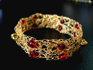 #GLSB04536 - Garnet Wire Crochet Bracelet. This Bracelet was created with no other but Red Glass Smooth Beads and Using the Single crochet technique , beads were combined with 28 gauge Non tarnish Gold Artistic Beading wires. Measures about 7 inches long and resizable upon request ~ Price + US$18.50 (S25)