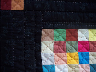Little quilt in Amish Colors made with Squares