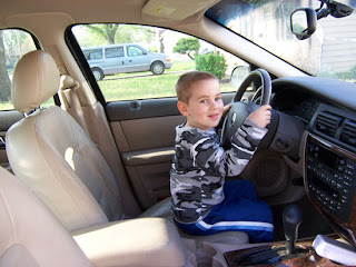 little kids driving cars